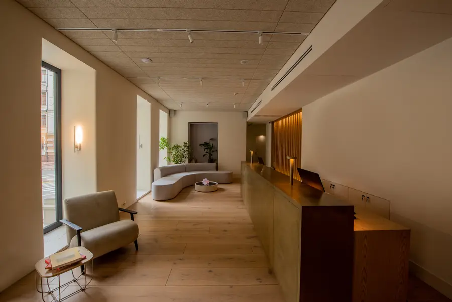 Interior of a luxury lobby with a clean, polished reception desk