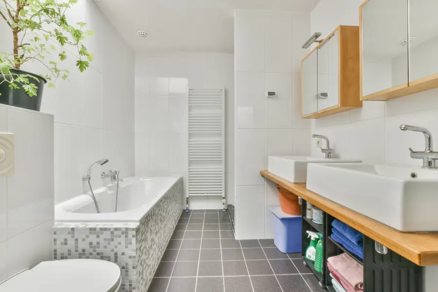 A clean, modern commercial restroom with stylish fixtures